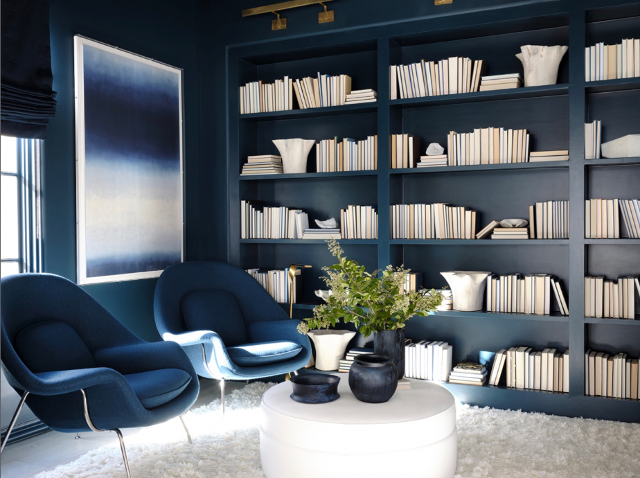 Beach home's dark blue library and TV room
