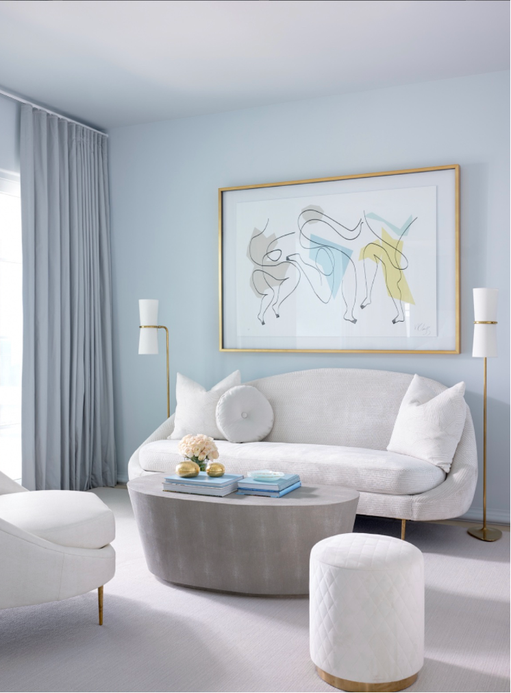 Beach home's serene seating area in primary bedroom suite
