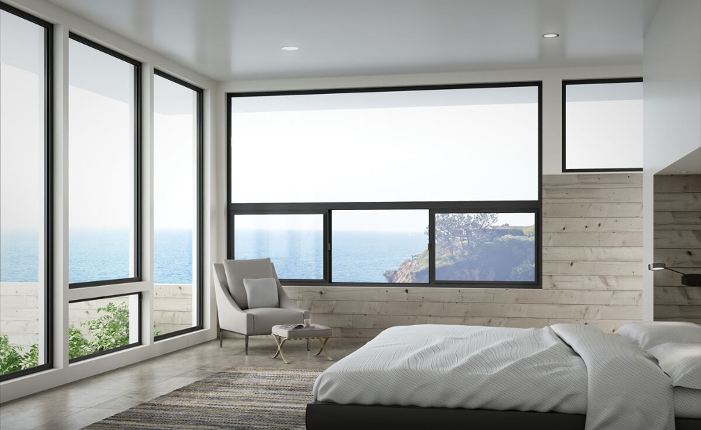 aluminum window frames in a contemporary beach home bedroom that looks out at the ocean