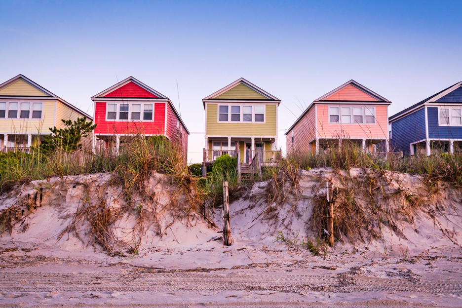 Colorfully painted beach homes on the sand