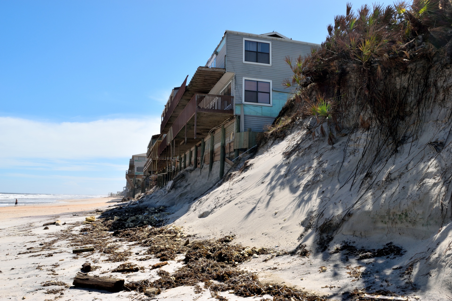Sand formed from eroding under a row of beach houses.