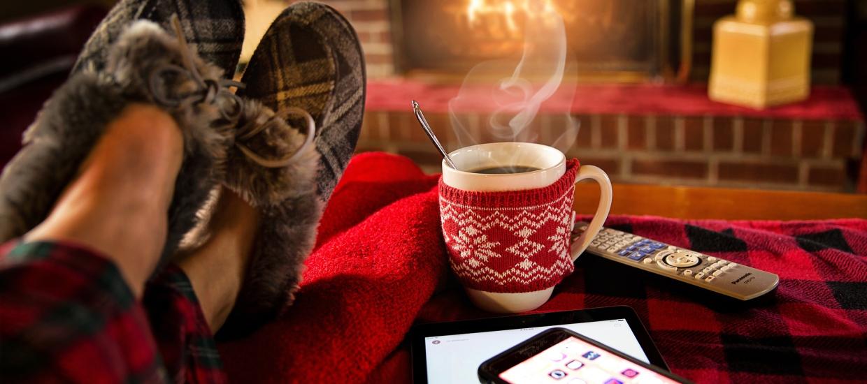 Listening to Christmas music by the fire.