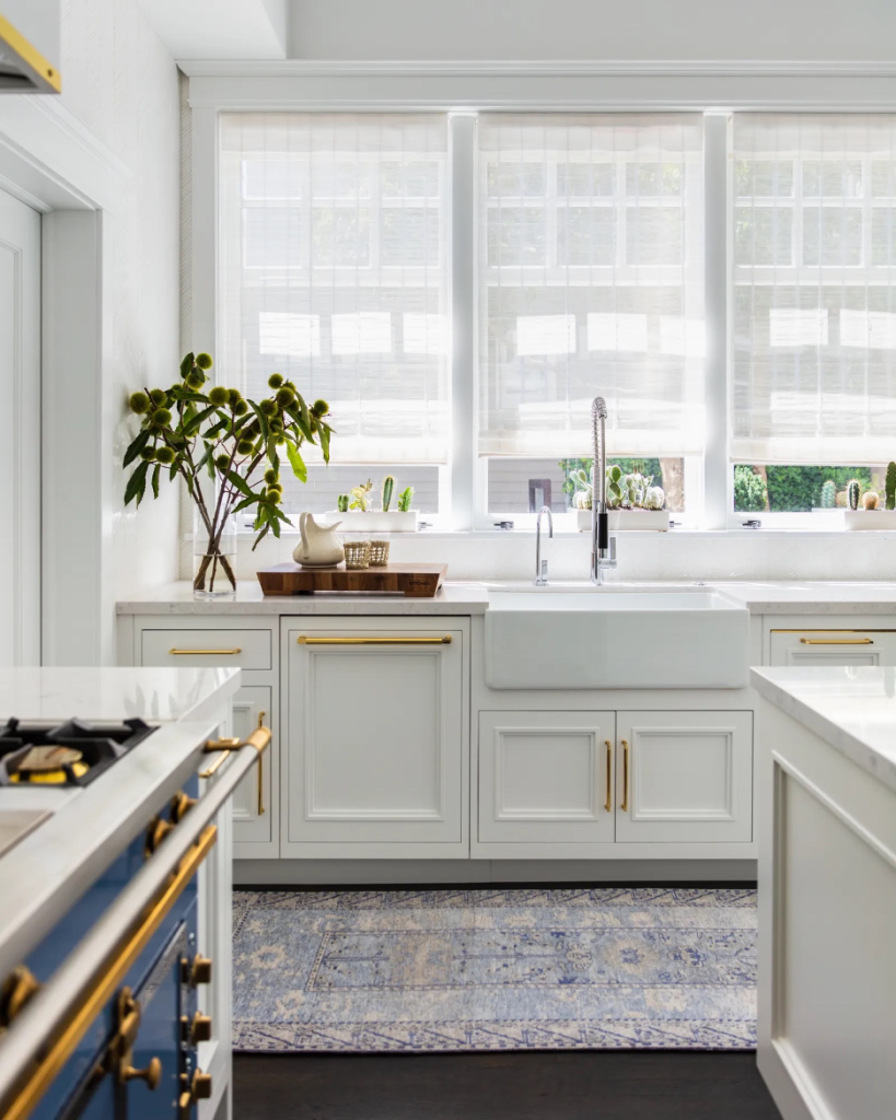 Refreshed kitchen hardware for a coastal home with a white and airy aesthetic and traditional design