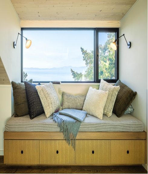 Built-in loft seating framed by spectacular views of ocean, moutains, and trees