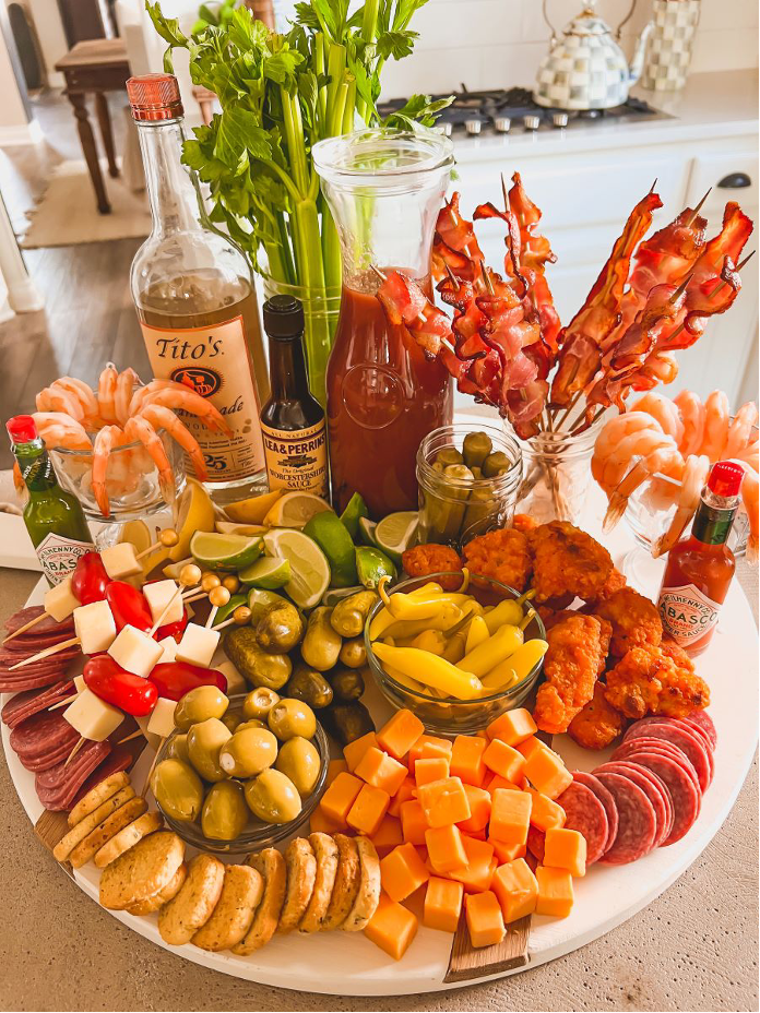 Coastal Sips Stations including a Bloody Mary Bar with all the garnishes inspired by the coast , Tabasco, and a charcuterie platter