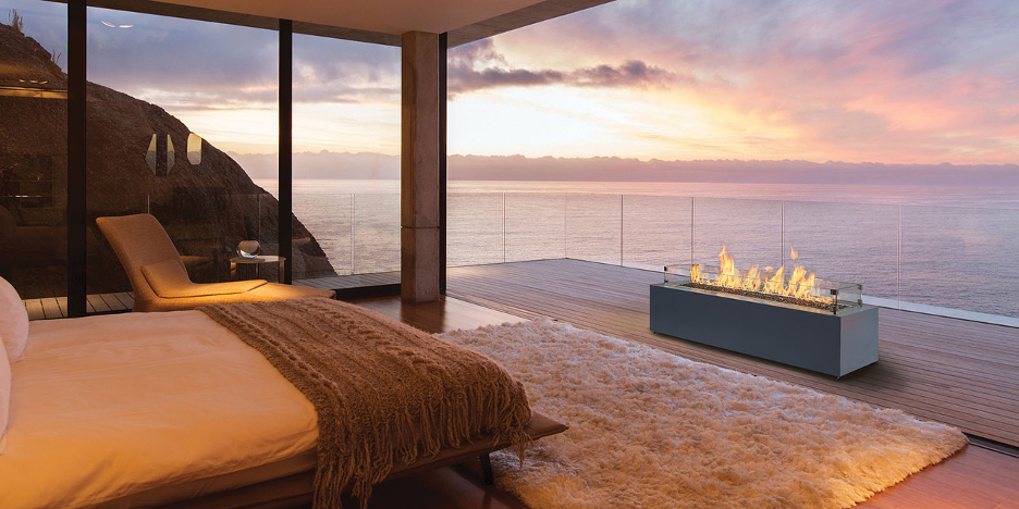 Ocean View Fireplace on a Rooftop bedroom Deck (Mid-Atlantic Coast) backdropped by transparent deck railing