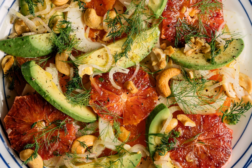 Fennel, Blood Orange, & Avocado Salad with Roasted Cashews on a salad plate