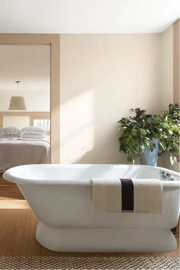 bathroom painted in a First Crush CSP-310, a complementary shade and part of the palette for Benjamin Moore’s Color of the Year 2026, Silhouette AF-655. 