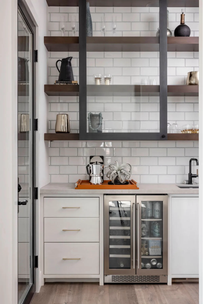 A full-service built-in coffee bar with a refrigerator and sink

