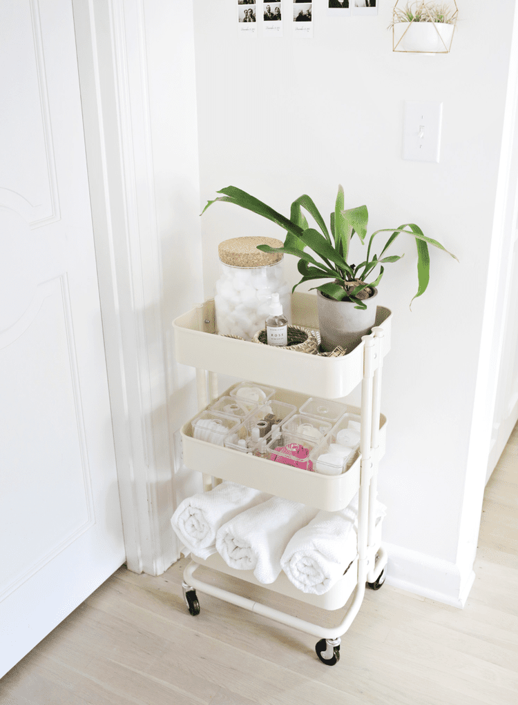 Rolling Carts and Modular Open Shelving to optimize storage in a beach guest room