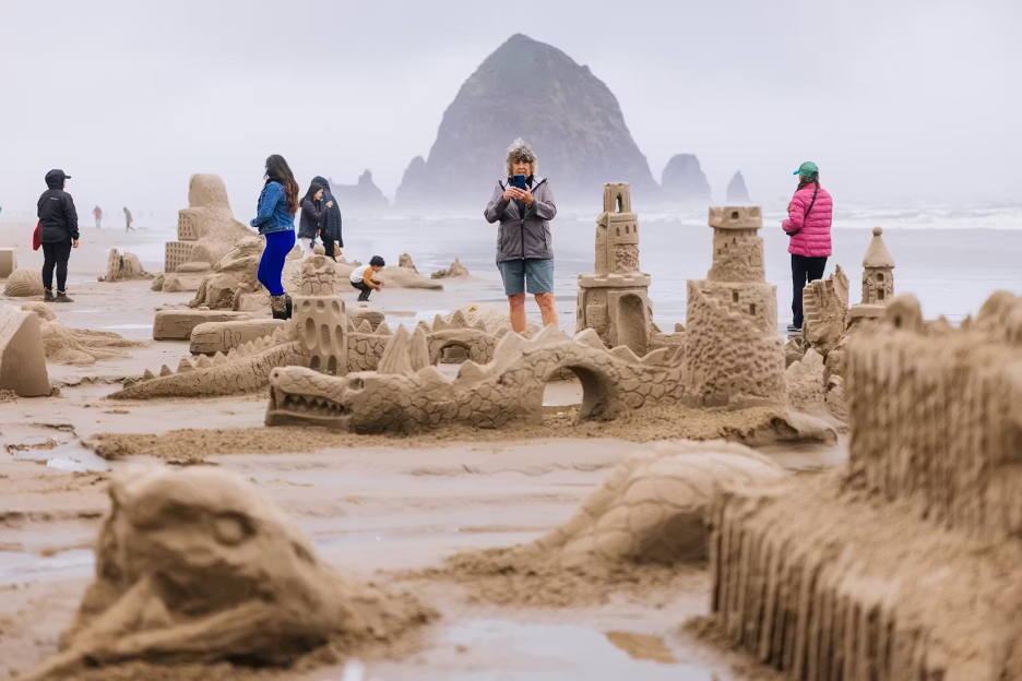 Cannon Beach Sandcastle Contest, 2025, Team Wine Castlers won first place in the large group division for their design, which integrates a dragon into a sandcastle.