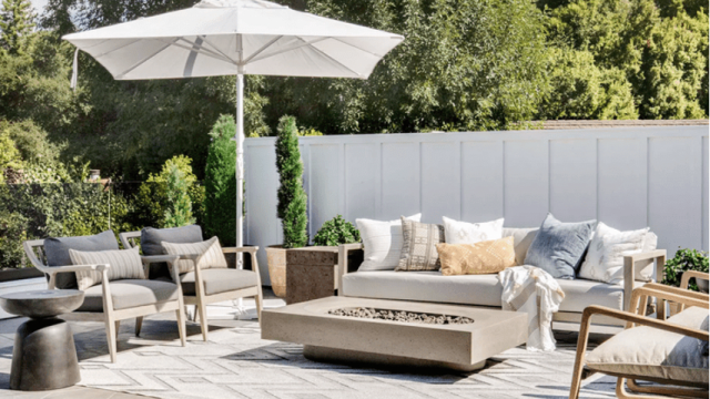 Board-and-batten fence wall creating a white privacy fence for an outdoor oasis
