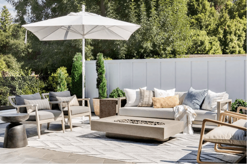 Board-and-batten fence wall creating a white privacy fence for an outdoor oasis