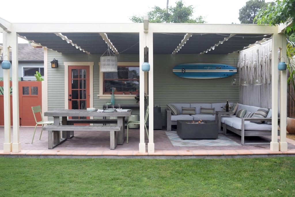 Garage and Patio Replacement, Santa Barbara, Stephanie D. Poole. The detached garage has a covered patio that creates an outdoor living room with an outdoor shower, seating and dining area, and grill.