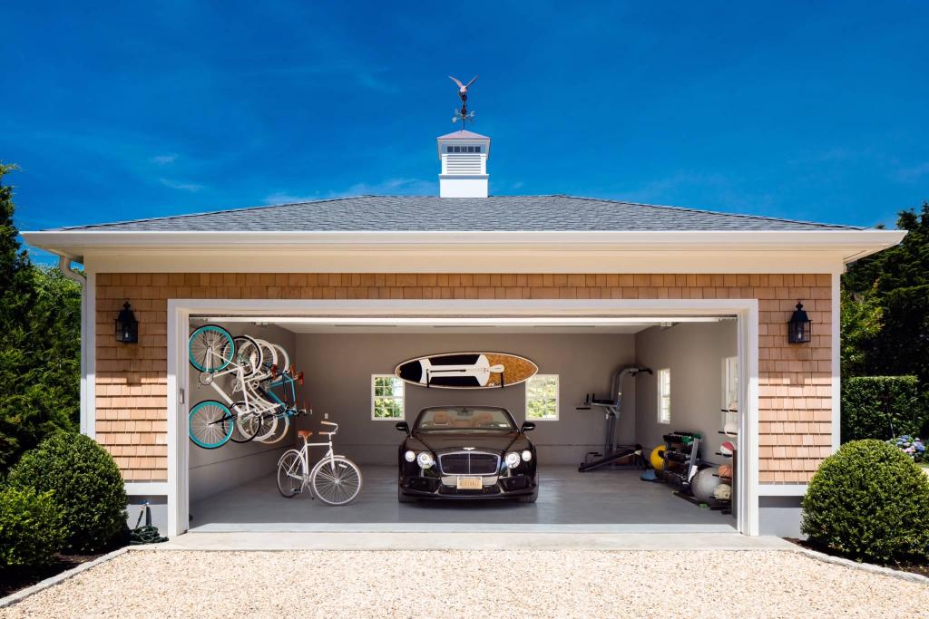 Southampton Beach House, Suk Design Group, New York. The garage combines vehicle parking with organized bicycle and recreational-equipment storage, making it a particularly useful model for beach properties.