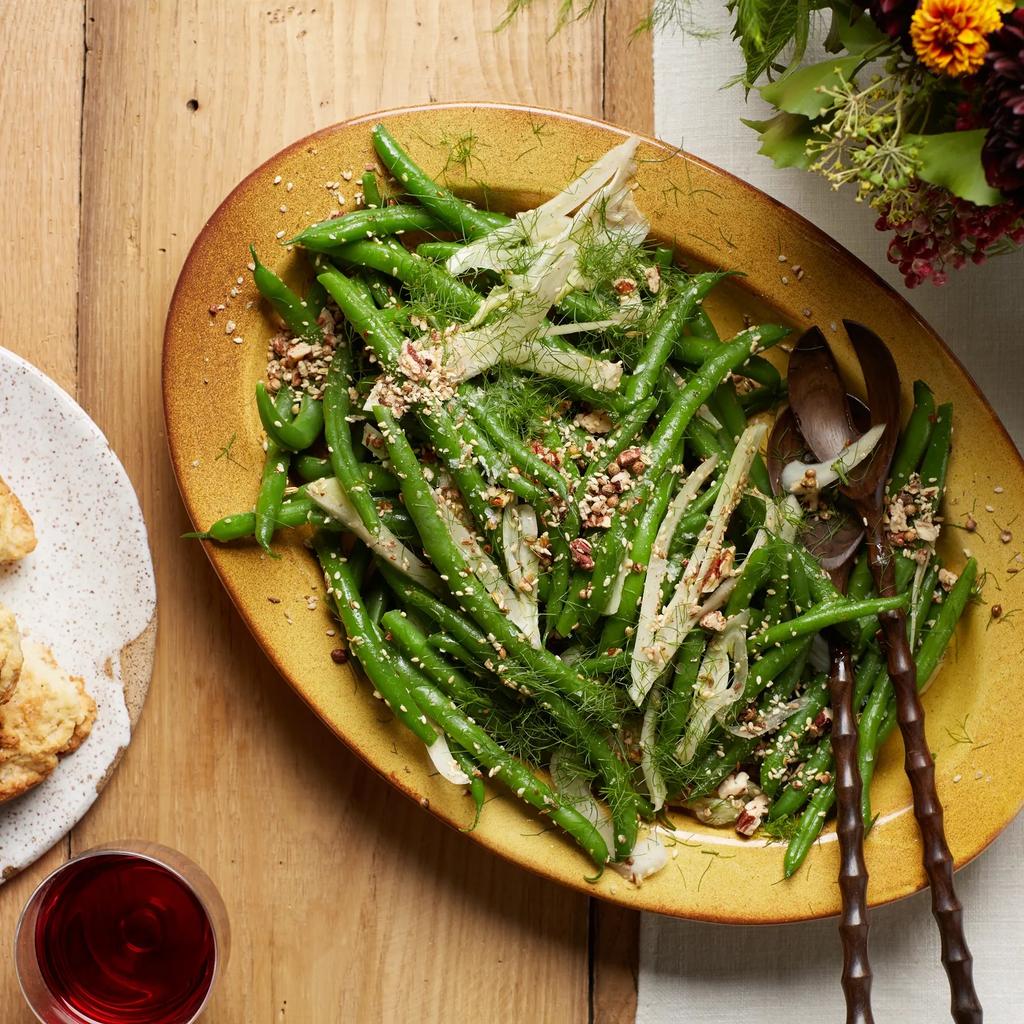 Green Bean Salad with Fennel and Toasted Pecan Dukkah served on a platter with salad serving utensils